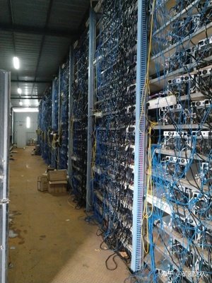 ASIC mining facility with racks of equipment cooled and maintained